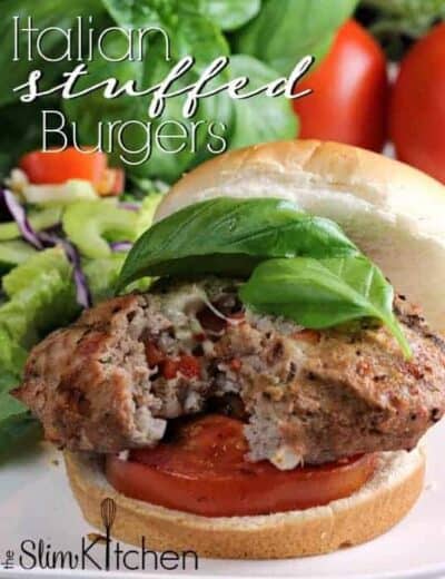 Italian Stuffed Turkey Burgers stuffed with cheese, pancetta and seasoning topped with grilled tomatoes and fresh basil