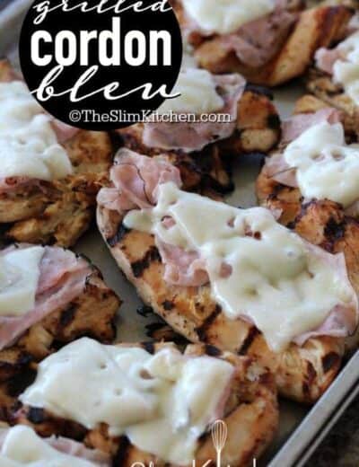 pieces of grilled chicken cordon bleu with cheese with text