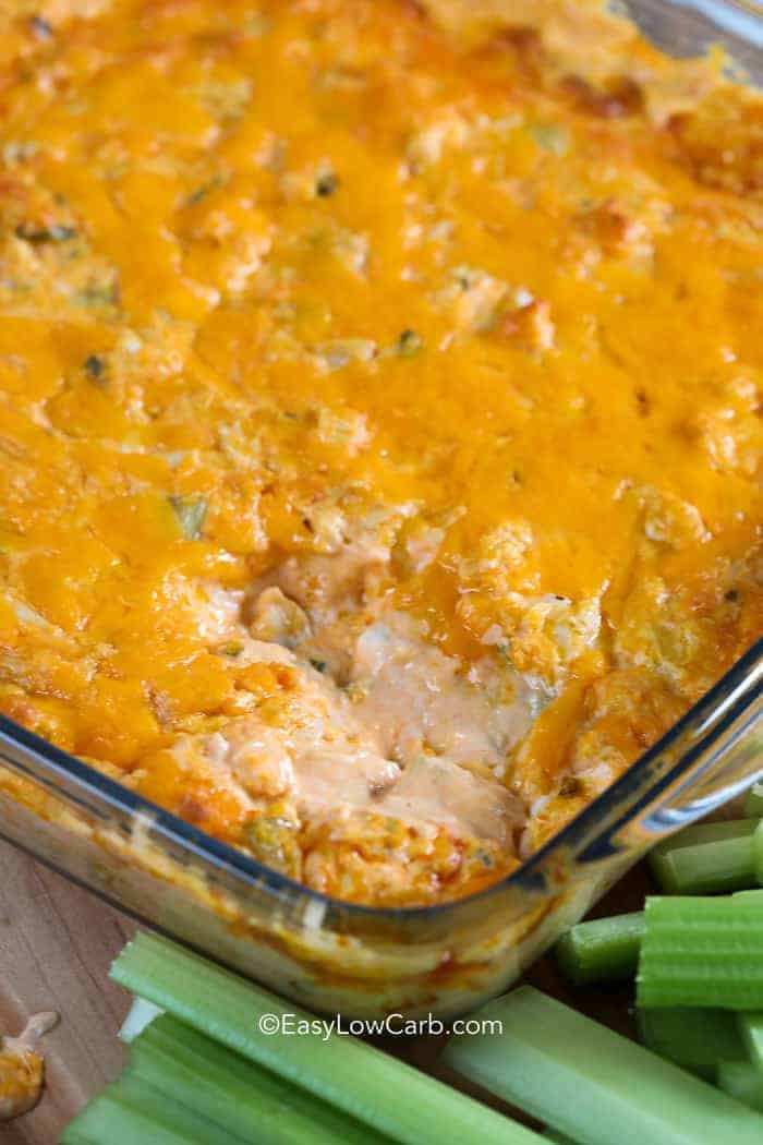 baked Buffalo Chicken Dip with a scoop out of it