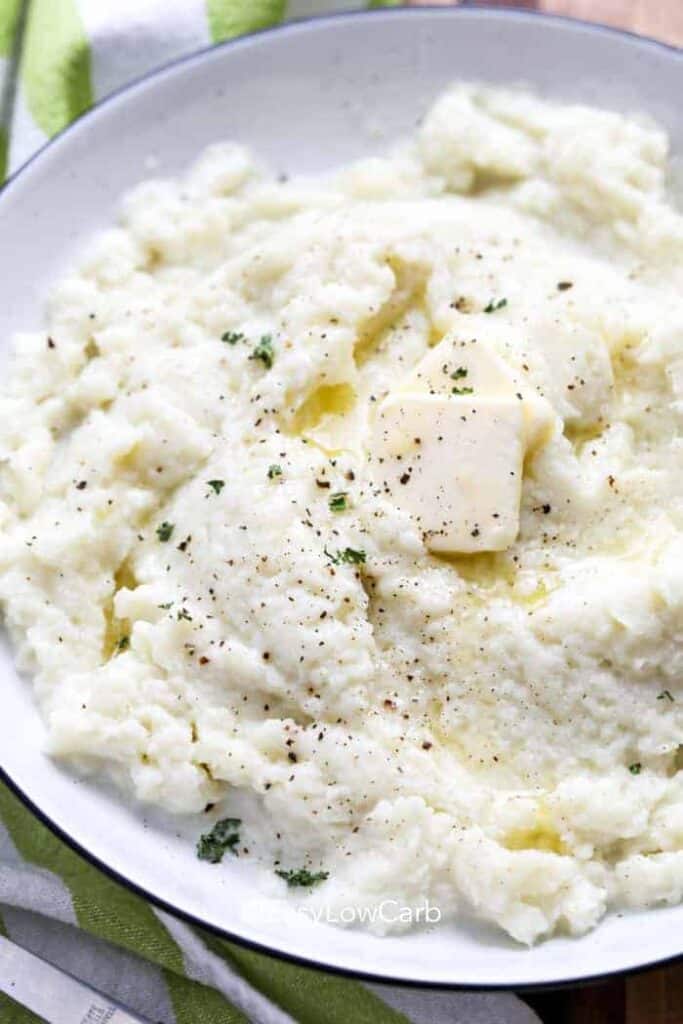 Mashed Cauliflower with butter in a white bowl