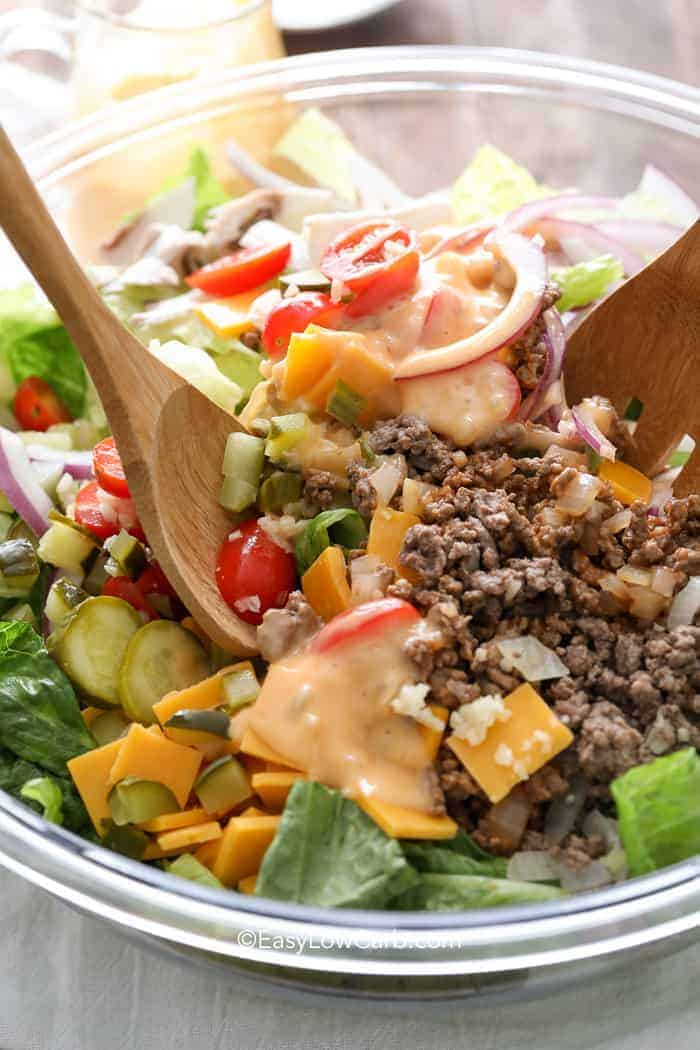 closeup of tossing Bacon Cheeseburger Salad