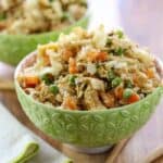 side view of two green bowls filled with Low Carb Cauliflower Fried Rice