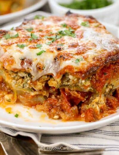 Easy Low Carb Zucchini Lasagna on a white plate, with a fork