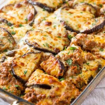 A clear baking dish with cooked Keto Eggplant Lasagna