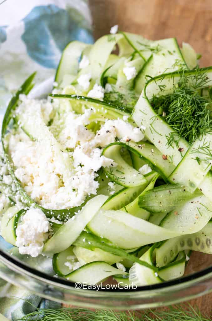 cucumber feta salad in a clear bowl.