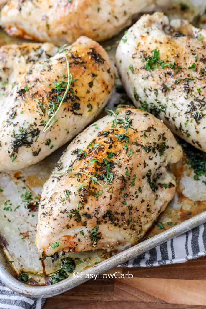 Baked Bone in Chicken Breasts non a baking tray with herbs