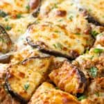 eggplant lasagna in a baking dish with melted cheese on the top