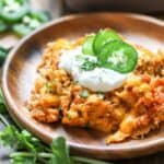 Cauliflower Enchilada Chicken Casserole on a wood plate