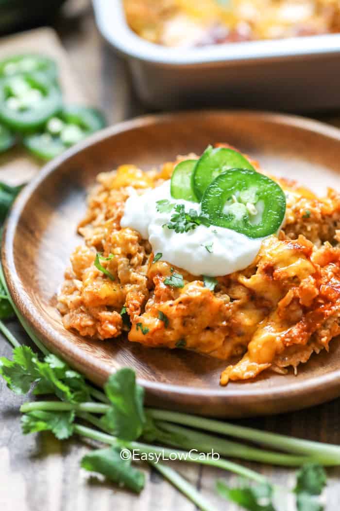 Cauliflower Enchilada Chicken Casserole on a wood plate