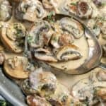 Dijon Mushroom Cream Sauce on a serving spoon