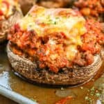 Stuffed Portobello Mushroom Caps with melted cheese on the top