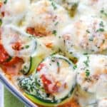 closeup of baked Zucchini Lasagna Roll Ups with melted cheese