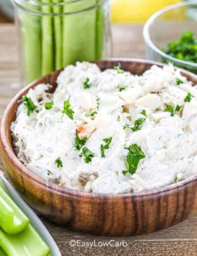 Low carb crab dip in a wood bowl with celery around