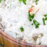 closeup of low carb crab dip with parsley in a wood bowl