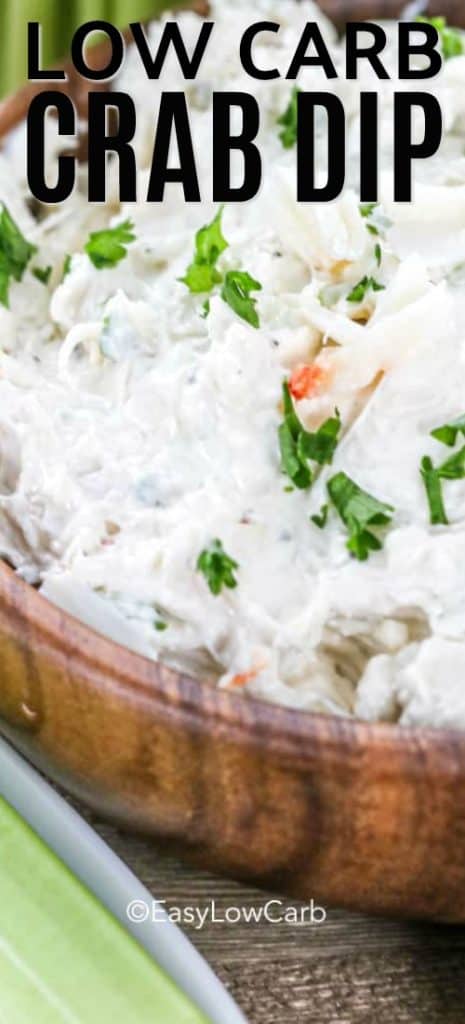 closeup of low carb crab dip with parsley in a wood bowl