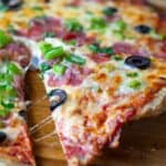 Chicken Pizza Crust topped with cheese, olives and green onion