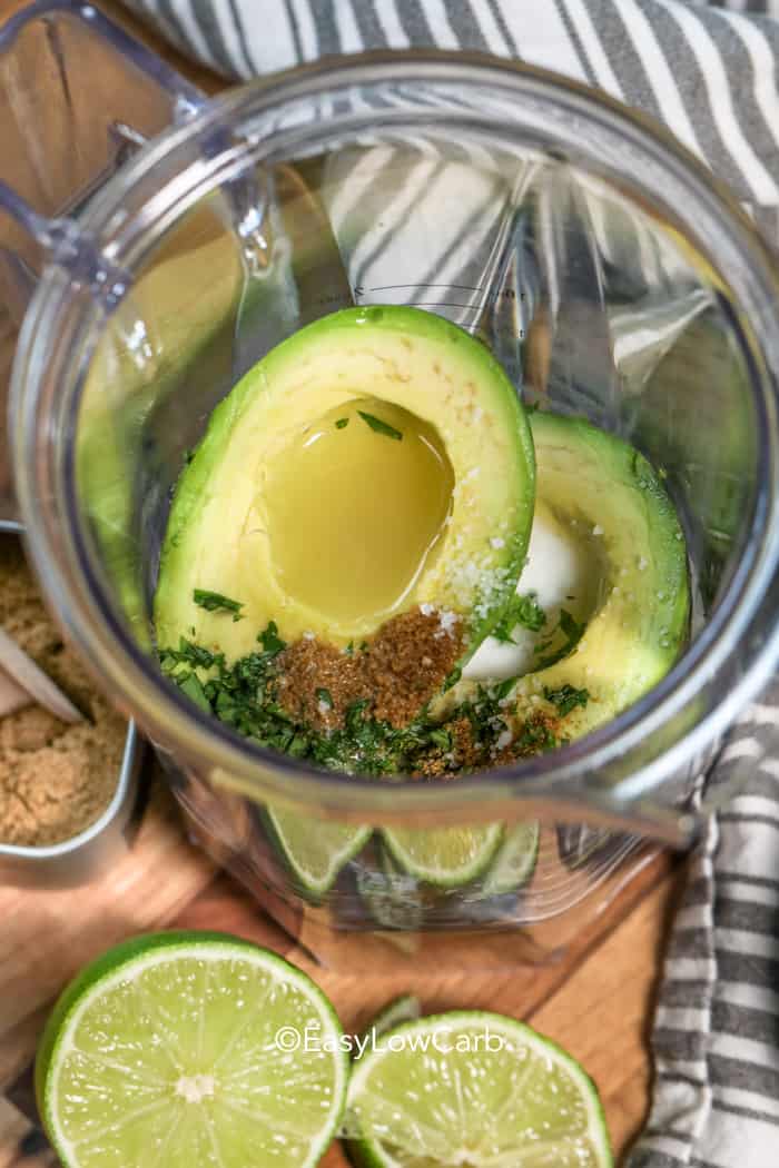 avocados and spices in a bowl for making low carb avocado dip