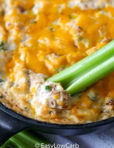 low carb Warm Bacon Dip in a skillet with celery dipper