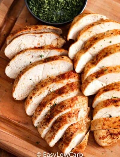 sliced Air Fryer Chicken Breasts on a wooden board