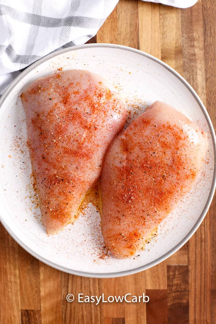 prepping Air Fryer Chicken Breasts with seasoning