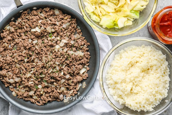 Ingredients to make unstuffed cabbage casserole assembled in separate dishes