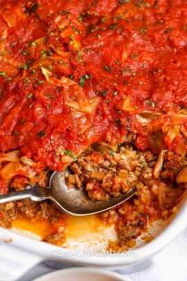 unstuffed cabbage casserole being served from a white baking dish
