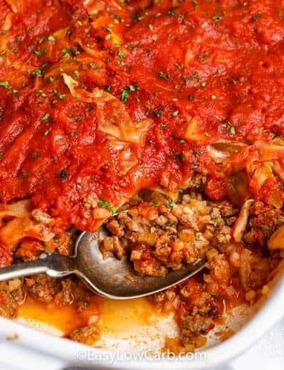 unstuffed cabbage casserole being served from a white baking dish