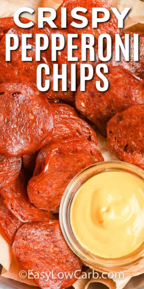 Pepperoni Chips in a parchment lined basket, with mustard on the side with writing.