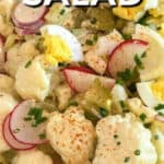 Cauliflower Potato Salad in a white bowl with a title.