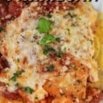 Low carb chicken parmesan served over spaghetti squash with a title.