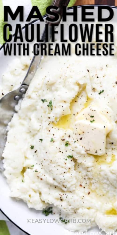 Loaded cauliflower mash with a pat of butter on top, with writing.