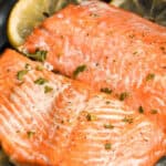 Salmon cooked with lemons in the air fryer, with a title.