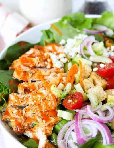 Close up of buffalo chicken salad in a large white bowl