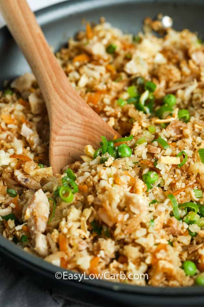 mixing Cauliflower Chicken Fried Rice in pan