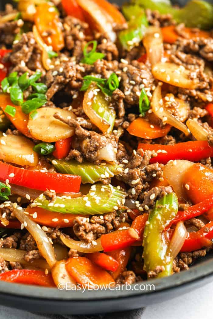 Easy Beef Stir Fry prepared in a pan, garnished with sesame seeds.