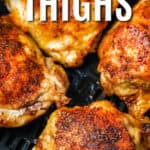 Air Fryer Chicken Thighs in an air fryer with writing