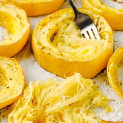 scooping out squash to show How to Cook Spaghetti Squash