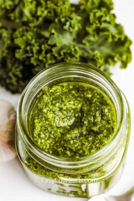 top view of Kale Pesto in a jar and kale beside it