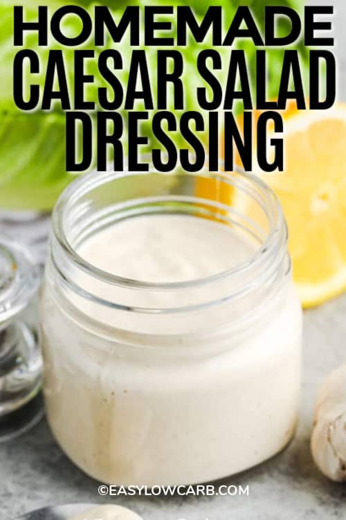 caesar dressing in a clear jar with writing