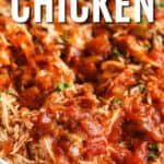 CrockPot shredded chicken salsa in a white dish, with writing