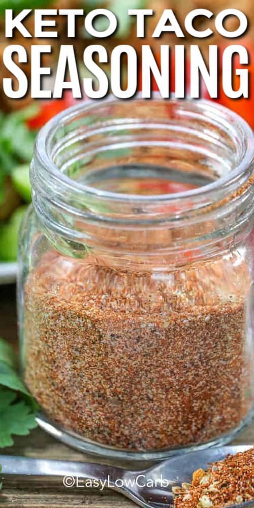 a glass jar of homemade taco seasoning mix with a spoon on the side and a title.
