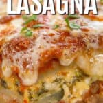 zucchini lasagna on a white plate with writing.