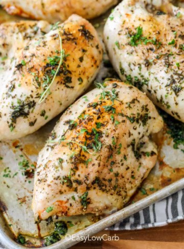 chicken with herbs on a sheet pan