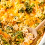 A wooden spoon dishing out low carb chicken broccoli casserole