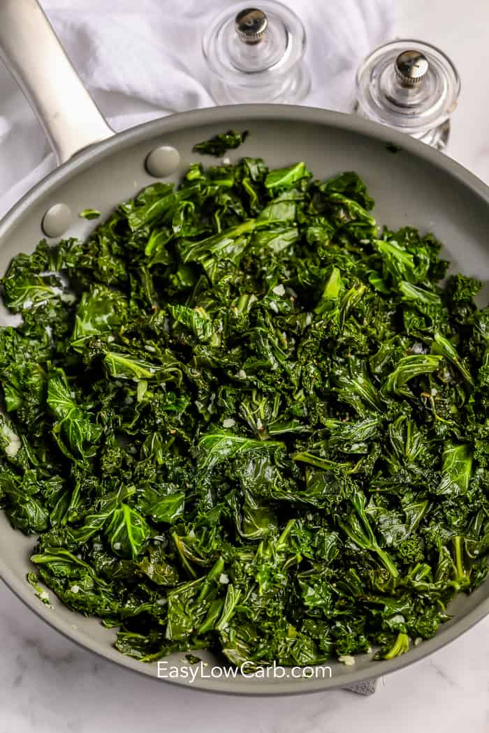 sauteed kale and garlic in a frying pan