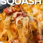 spaghetti squash and chicken served in a white casserole dish, with a fork full of the casserole being pulled up, with a title