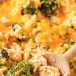 A wooden spoon dishing out low carb chicken broccoli casserole with a title.