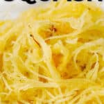 cooked spaghetti squash in glass bowl with a title.