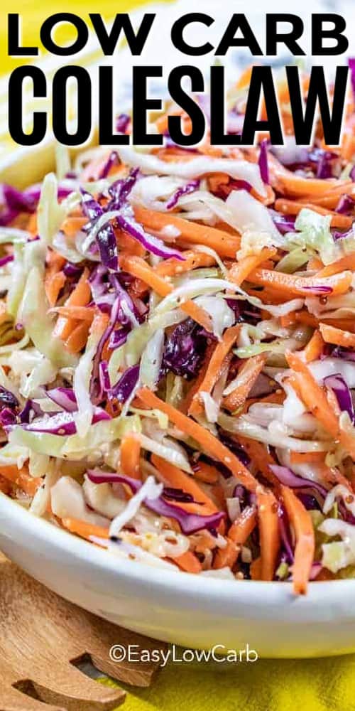 Low carb coleslaw served in a white bowl with a wooden spoon on the side with a title