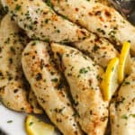 Low Carb Chicken Tenders on a plate with lemon slices